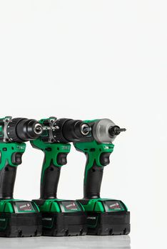 Drill. Set of cordless drills on a white background. Tool for drilling and making holes. Screwdriver set with high capacity spare batteries