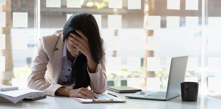 Businesswoman get stressed while having a problem at work in office..