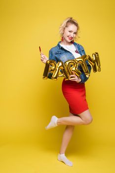 Fashionable womancelebrating a party event having fun and smiling with balloons