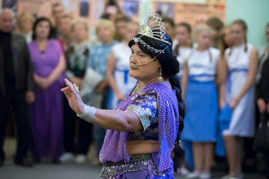 The old woman dances Indian dances. Active aging