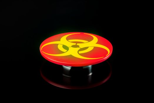 The threat of using chemical weapons. Weapons banned in the world. Big red button with chemical weapons symbol on black background.