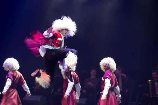 Belarus, Gomel, February 27, 2018. Concert hall. Speech of the national Georgian ballet Sukhishvili.Georgian dancer performs a jump on stage