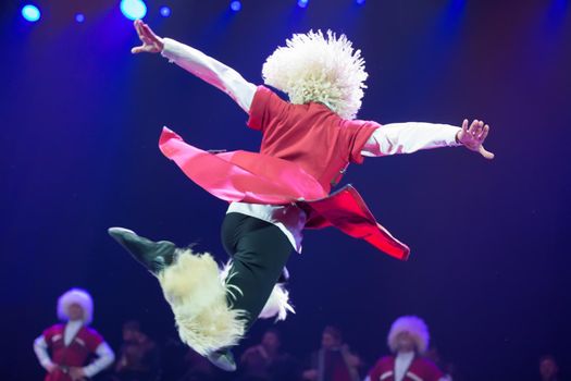 Belarus, Gomel, February 27, 2018. Concert hall. Speech of the national Georgian ballet Sukhishvili.Georgian dancer performs a jump on stage