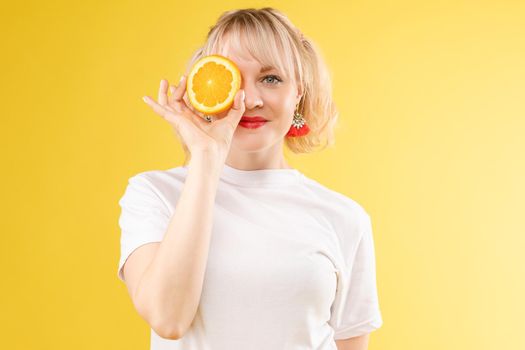 Portrait of a cool cheerful woman girl with oranges. Juice ads. Positive, harmony.