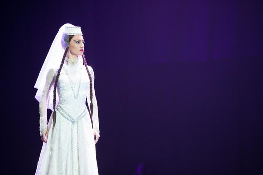 Belarus, Gomel, February 27, 2018. Concert hall. Speech of the national Georgian ballet Sukhishvili.A Georgian woman in a national white costume dances Georgian dance