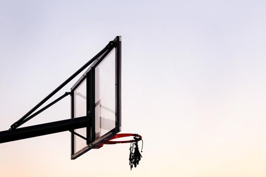 basketball hoop with the sky in the background, concept of urban sport outdoors, copy space for text