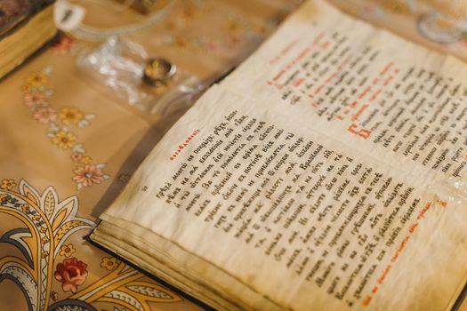 Holy book opened on the table in church. Orthodox faith. Equipment for praying. Pray for people life. Pray to god