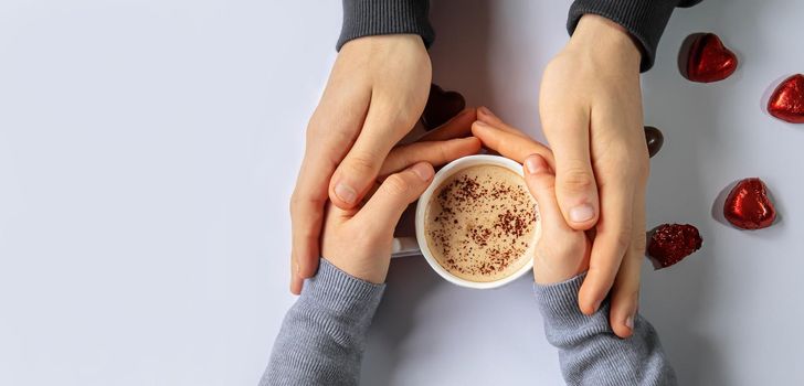 Cup drink for Breakfast in the hands of lovers. Selective focus.people