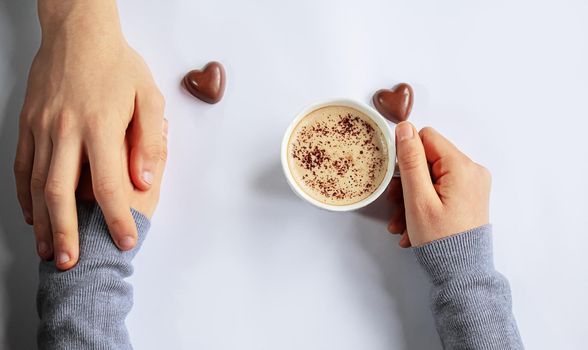 Cup drink for Breakfast in the hands of lovers. Selective focus.people