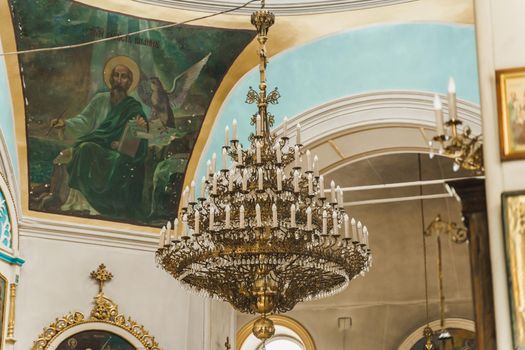 Big chandelier in the church. Church interior. Orthodox faith. Equipment for praying. Pray for people life. Pray to god