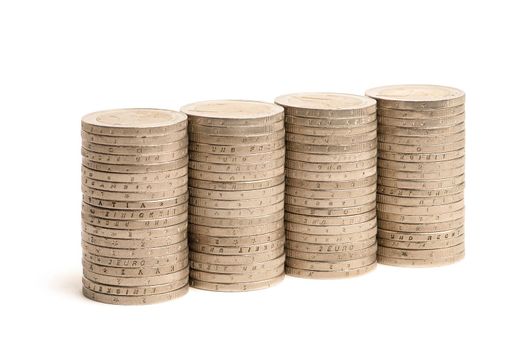 Stacks of coins on a white isolated background. 2 euro coins in a stack