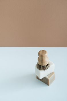 zero waste bamboo brush with soap for dishwashing in minimalistic style. High quality photo