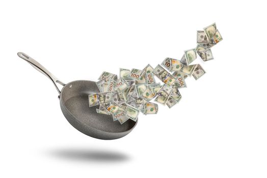 Rising food prices. The concept of rising cost of food. Money in a pot. Dollar bills fly over a frying pan as a symbol of money or salary for food on a white background.