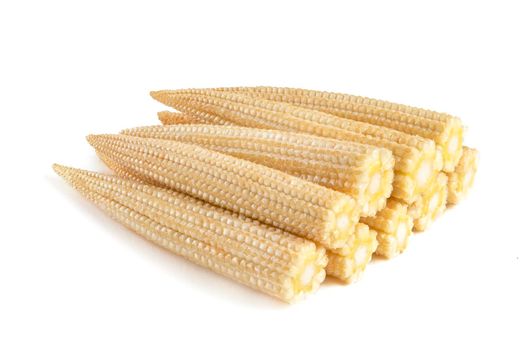 Corn on a white background. Baby corn isolated on white homogeneous background, clipping path, full depth of field