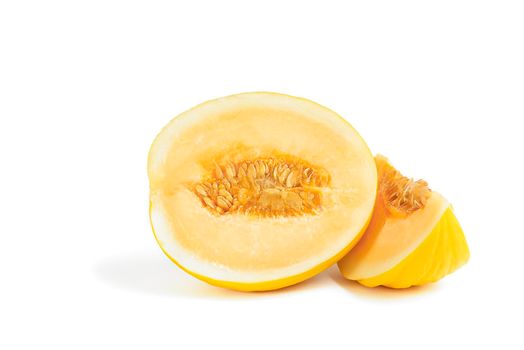 Melon on a white background. Yellow melon on a white isolate. Fresh juicy piece of melon with shadow on a white background. For insertion into a project, design or advertisement.