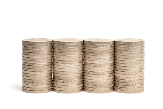 Stacks of coins on a white isolated background. 2 euro coins in a stack