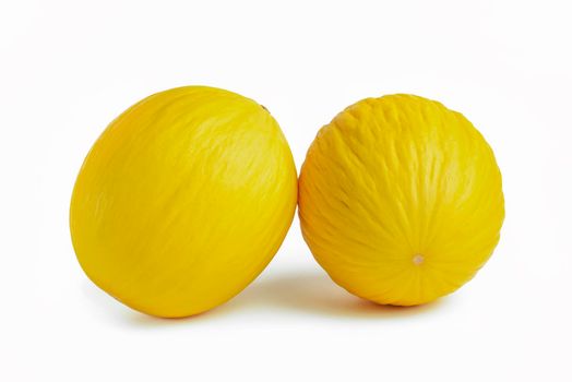 Melon on a white background. Two yellow melons on a white isolate. For insertion into a project, design or advertisement