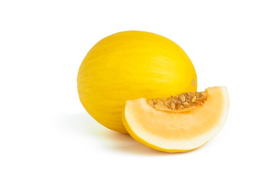 Melon on a white background. Yellow melon on a white isolate. Fresh juicy piece of melon with shadow on a white background. For insertion into a project, design or advertisement.