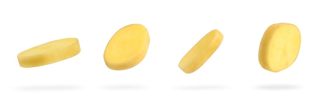 A slice of fresh unpeeled potatoes falls on a white background. A set of chopped raw potatoes. Food levitation concept. High resolution image.