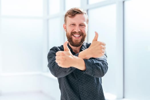 happy businessman showing thumbs up. photo with space for text
