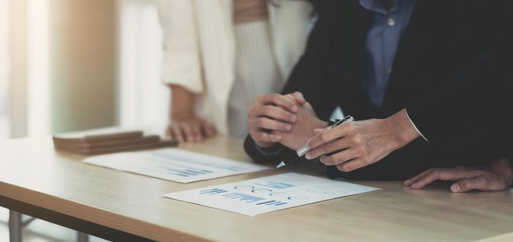 Team of business people working together in the meeting room office, teamwork background charts and graphs banner, double exposure successful teamwork,business planning concept..