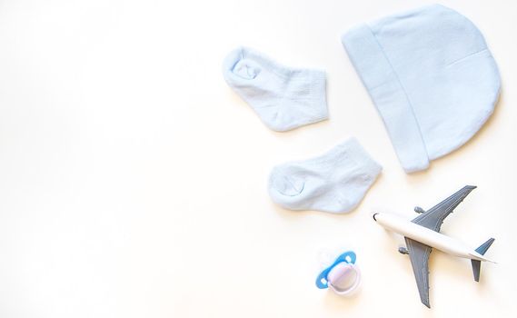 airplane and baby accessories. Concept of flying with young children. Selective focus.