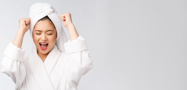 Spa skincare beauty Asian woman drying hair with towel on head after shower treatment. Beautiful multiracial young girl touching soft skin.