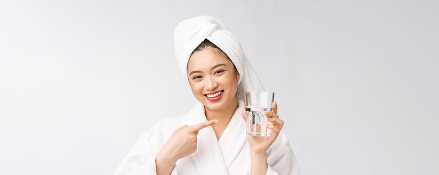 Healthy young beautiful woman drinking water, beauty face natural makeup, isolated over white background