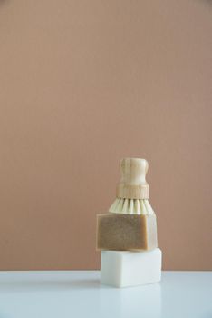 zero waste bamboo brush with soap for dishwashing in minimalistic style. High quality photo