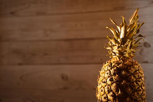 Pineapple tropical fruit on wooden background. Citrus fruit with vitamin c for helth care