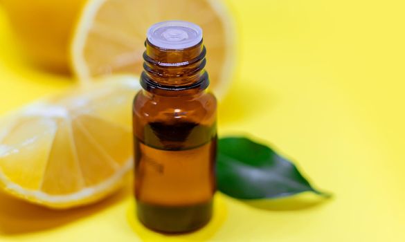 lemon essential oil on a yellow background. Selective focus.nature