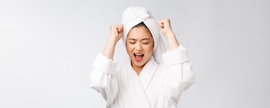 Spa skincare beauty Asian woman drying hair with towel on head after shower treatment. Beautiful multiracial young girl touching soft skin.