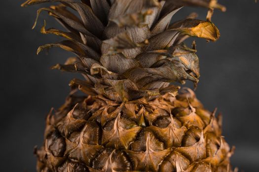 Pineapple tropical fruit on dark stone background background. Citrus fruit with vitamin c for helth care