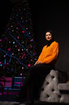 Muslim Christmas celebration. Model weared black hijab is prepearing for new year celebration. Islam religion