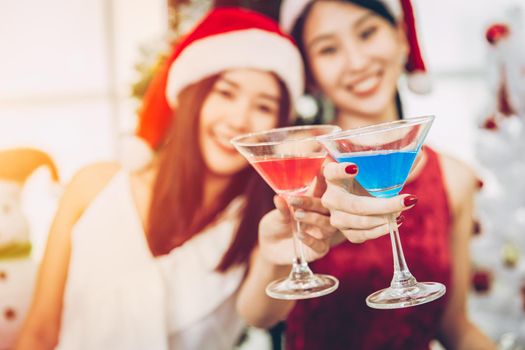 Asian cute girl teen party drinking in Christmas New year eve together happy enjoy and fun.