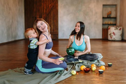 Conversation and tea with two yogis. A child playing next to the yogis