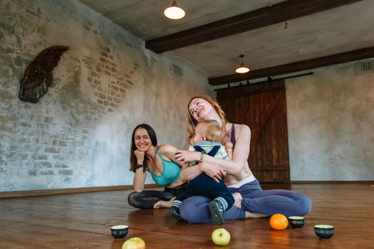 Two girls yoga in the loft and a baby