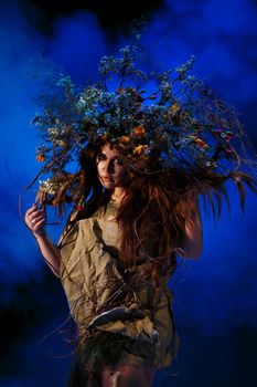 Dryad, Muse from the forest, standing in blue light and smoke