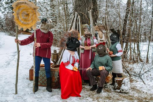 People in national costumes with animal heads celebrate the arrival of the pagan holiday Maslenitsa.