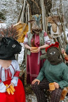 People in national costumes with animal heads celebrate the arrival of the pagan holiday Maslenitsa.