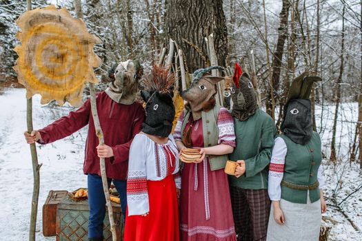 People in national costumes with animal heads celebrate the arrival of the pagan holiday Maslenitsa.