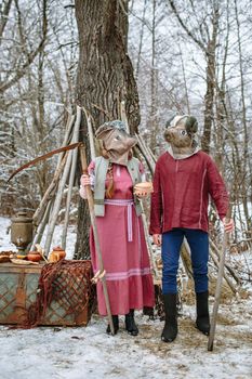 People in national costumes with animal heads celebrate the arrival of the pagan holiday Maslenitsa.