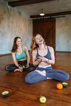 Conversation and tea party of two yogis in the loft