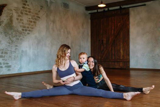 Two girls yoga in the loft and a baby