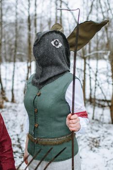 A man in a national costume with the head of an animal celebrates the arrival of the pagan holiday Maslenitsa.