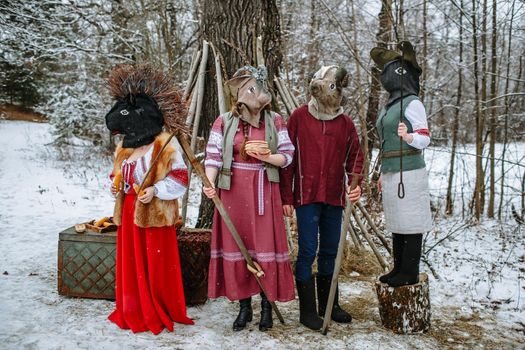 People in national costumes with animal heads celebrate the arrival of the pagan holiday Maslenitsa.