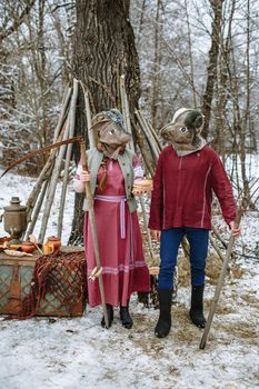 People in national costumes with animal heads celebrate the arrival of the pagan holiday Maslenitsa.