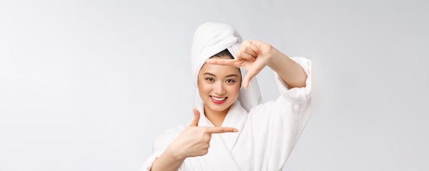 Beautiful Woman face and she making frame with hands with health skin, concept for skin care , asian beauty