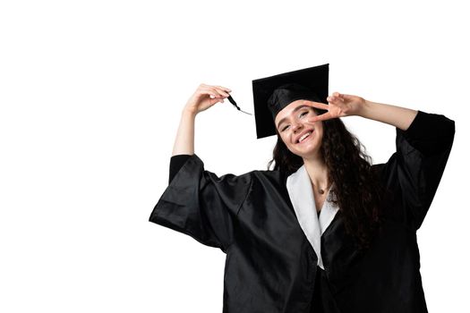 Graduate girl with master degree in black graduation gown and cap on white background. Happy young woman careerist have success in her business.