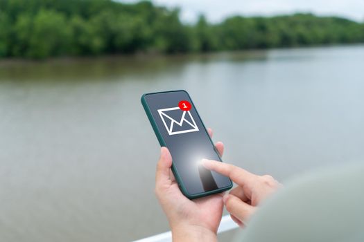 Woman hand using smartphone to send and recieve email. Business communication  technology concept.